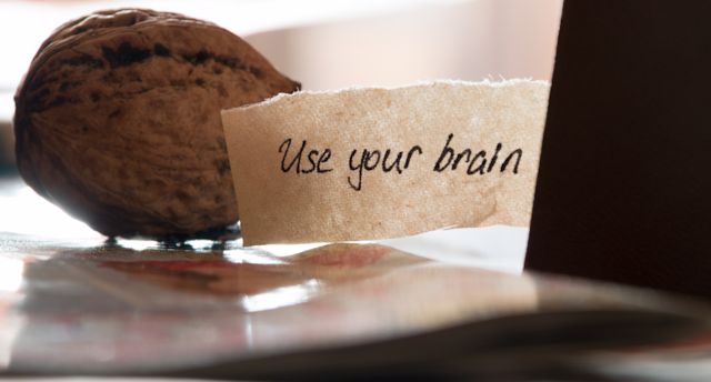 Use your brain, hand lettering,  book and walnut